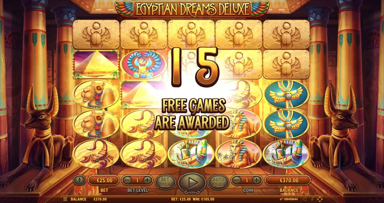 Egyptian Dreams Deluxe: A '15 FREE GAMES ARE AWARDED' banner over the reels in a darker temple hall...