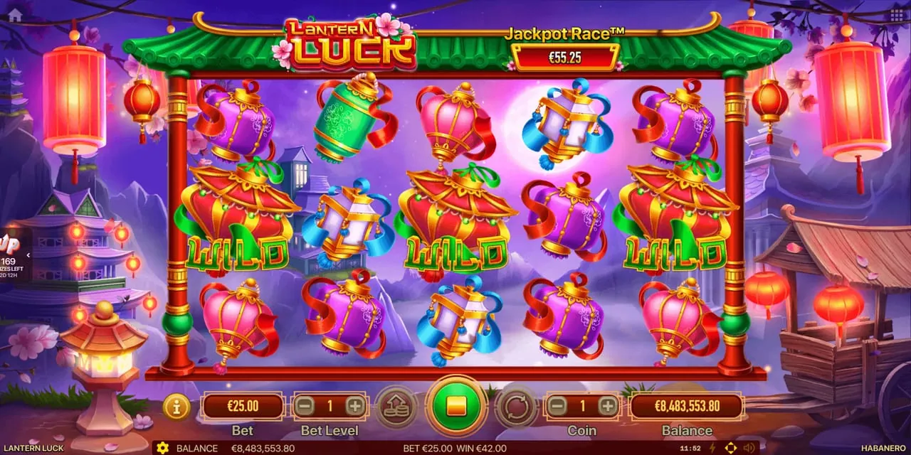 Lantern Luck: The re-spins against a purple night sky with a moon and hanging red...