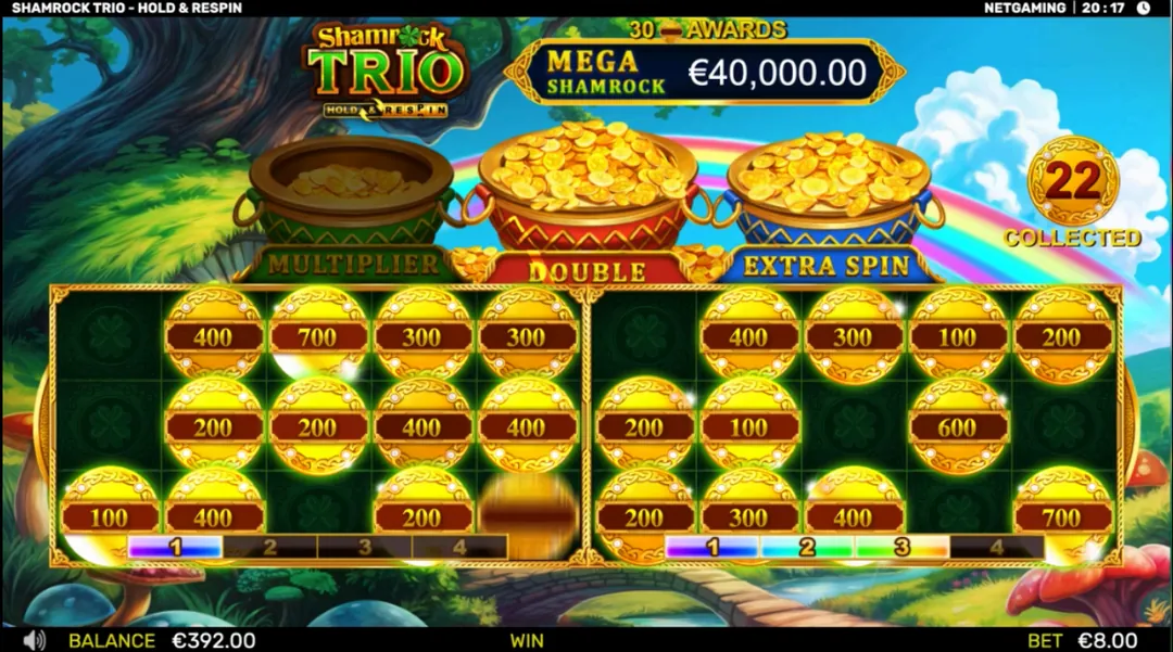 Shamrock Trio - Hold & Respin: Two grids at once in NetGaming's shot: gold coins valued 100 to 700 on both,...