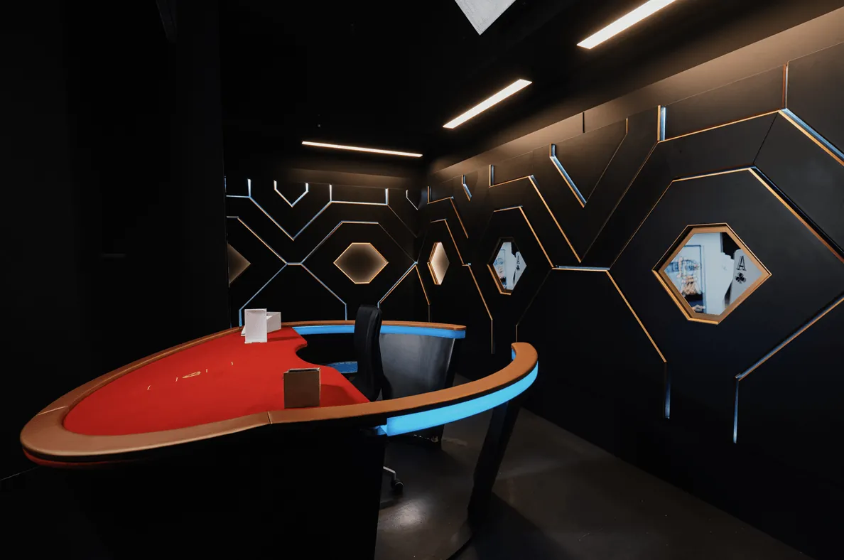 War of Bets: BetGames' photo of the empty War of Bets studio: a red-topped table with a...